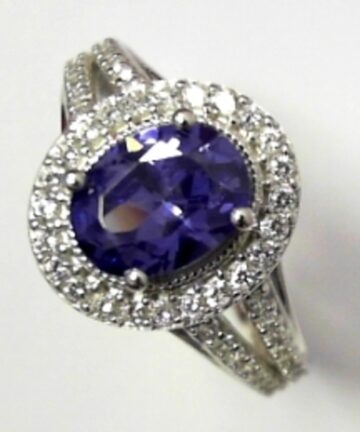 W/G 4CLAW BLUE CZ OVAL DRESS RING