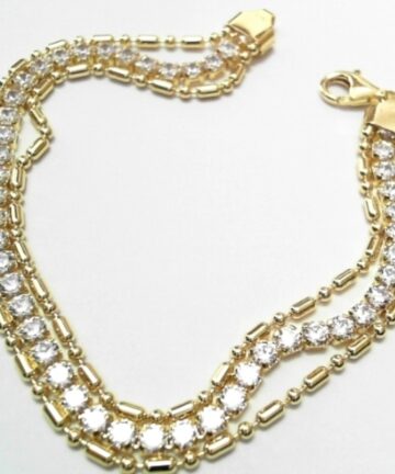ST---47 SILVER YELLOW PLATED TENNIS BRACELET